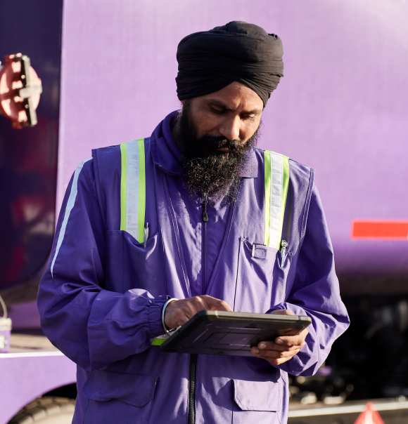 Service Professional using smart energy app on tablet